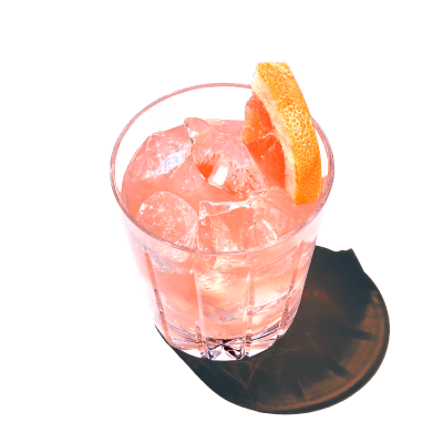 A glass of a spicy paloma is served with ice cubes and vodka from pinnacle vodka.